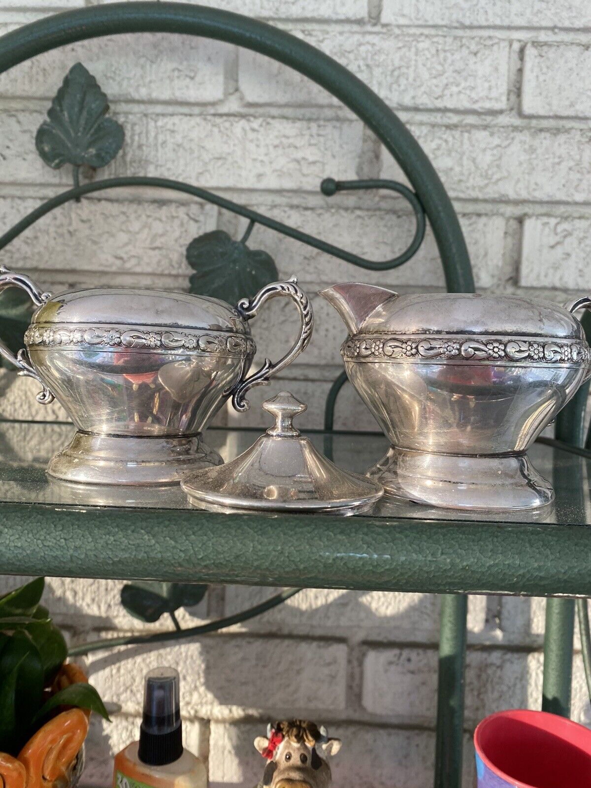 vintage silver on copper sugar bowl and creamer set needs cleaned