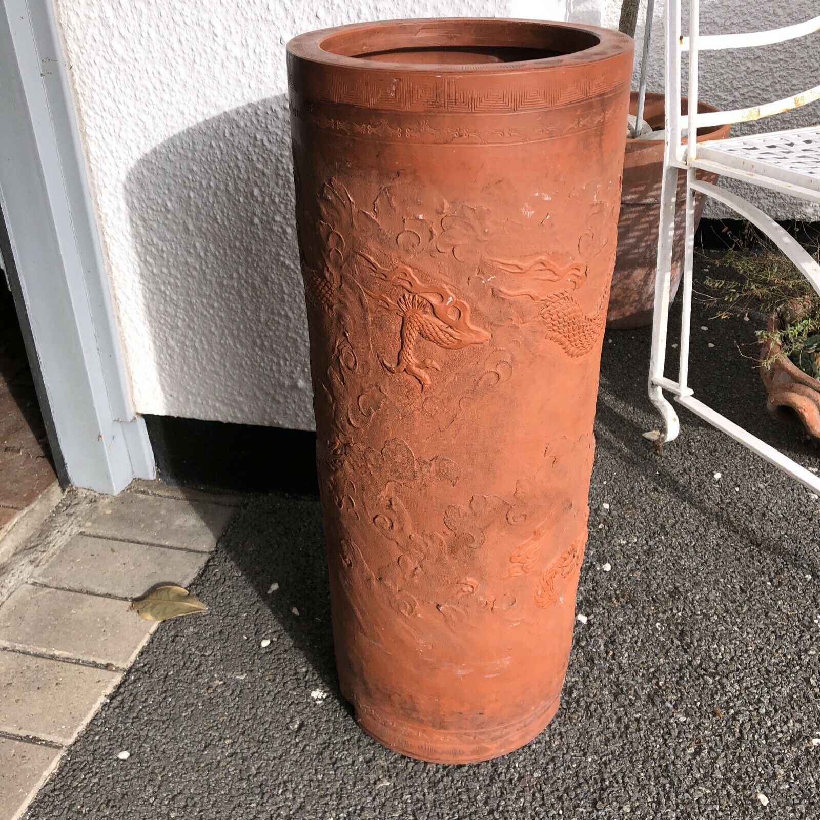 Terracotta tall vase with chinese graphics