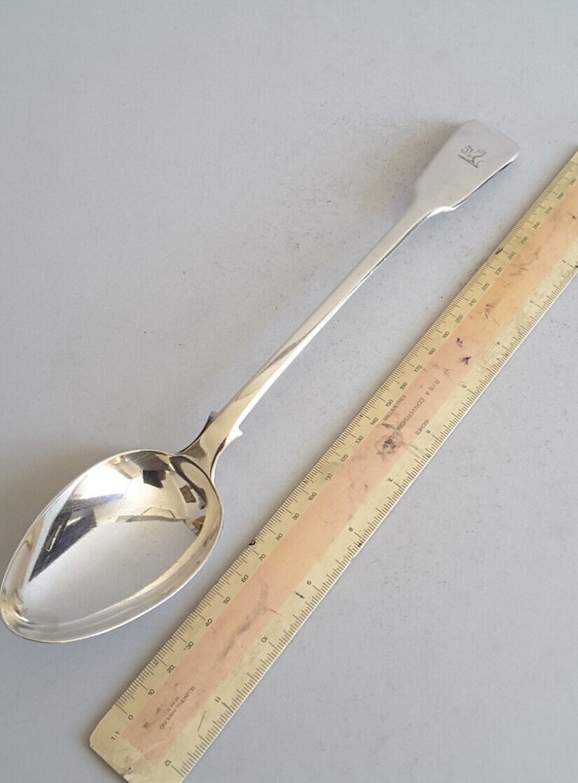 Antique Valuations: LARGE, CRESTED, ANT. SOLID SILVER STUFFING  SPOON. 143g   L. 29.9cms. LON. 1820.