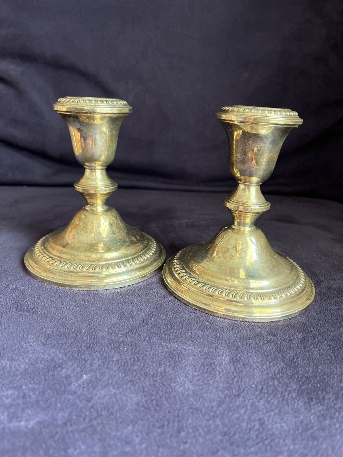 Antique Valuations: Pair of Vintage Empire Sterling Silver Weighted Candle Holders