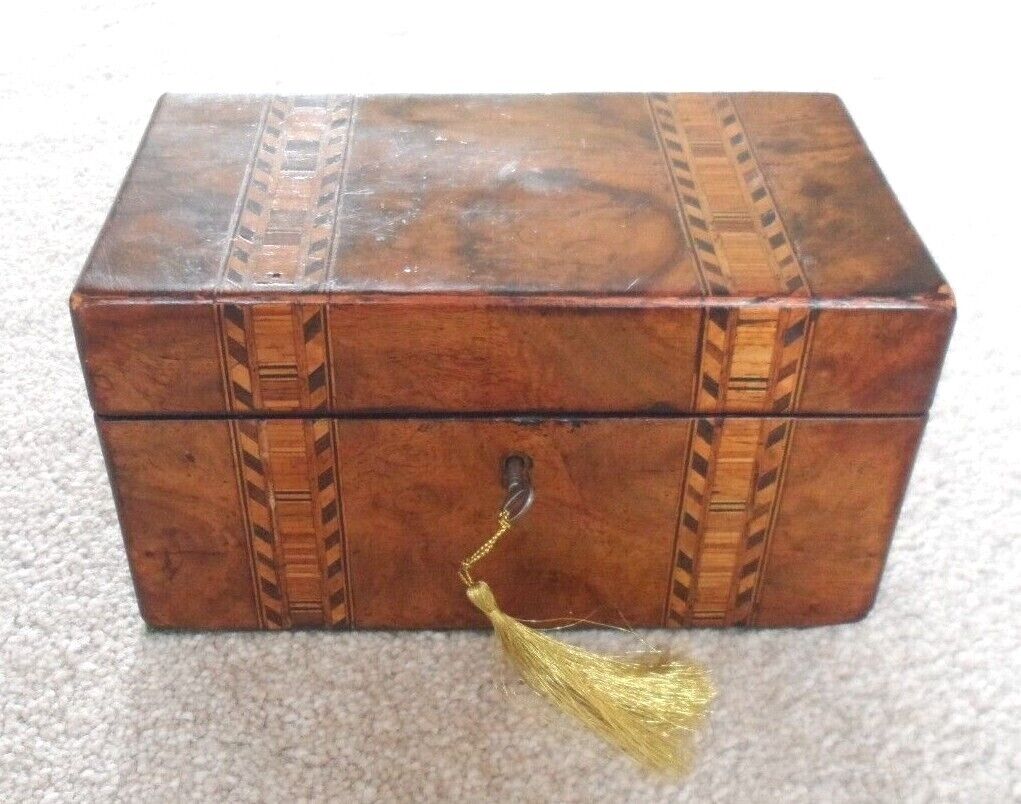 Antique Valuations: Antique Tunbridge Ware tea caddy with internal lids and locking key.
