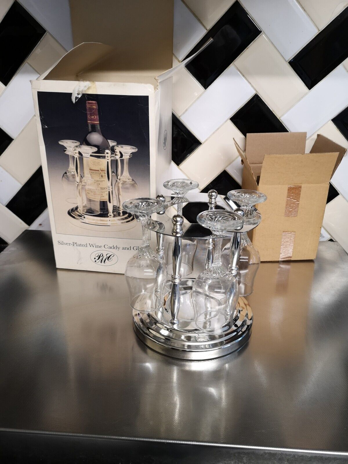 Antique Valuations: Vintage Boxed Silver Plated Wine Caddy with twist stem glasses
