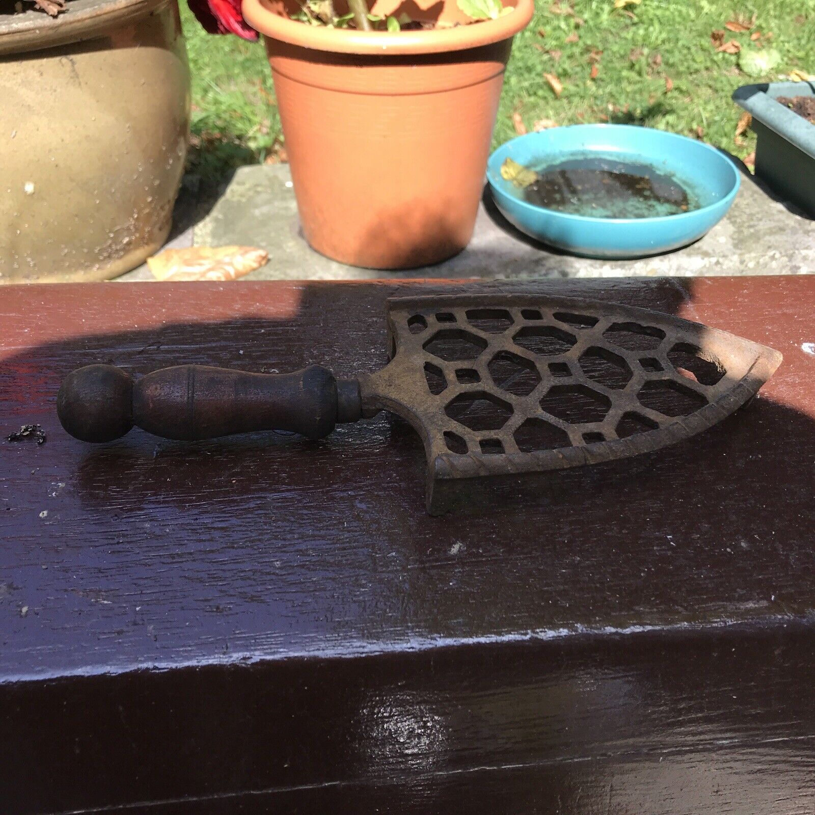 Antique Valuations: victorian iron stand with wooden handle