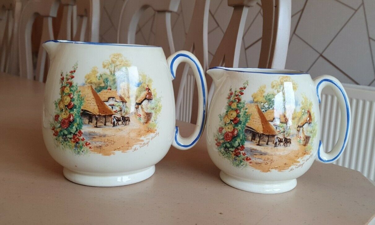 Antique Valuations: Matching Vintage Pair of Pottery Jugs 'The Village Smithy' olde England scene