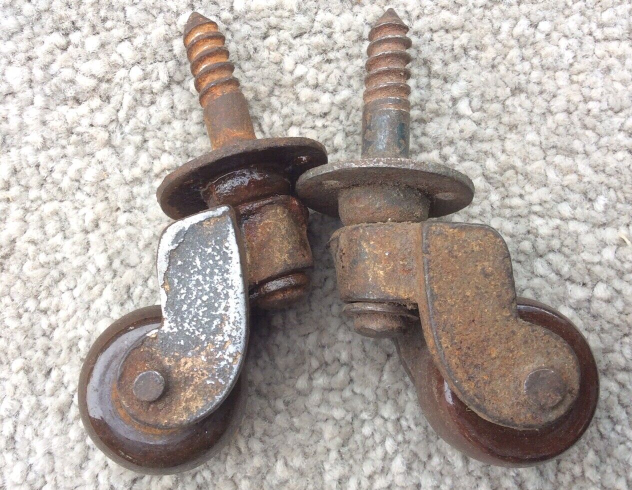 Antique Valuations: A Pair of Small Antique Brass Castors with Brown porcelain wheels